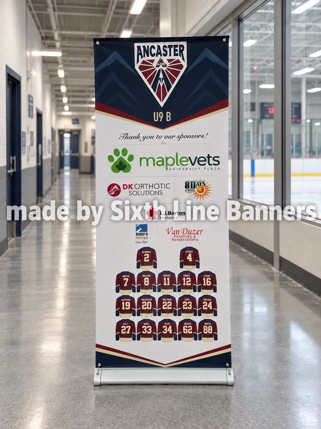 Ancaster U9 B retractable banner displayed in a hockey arena hallway, made by Sixth Line Banners